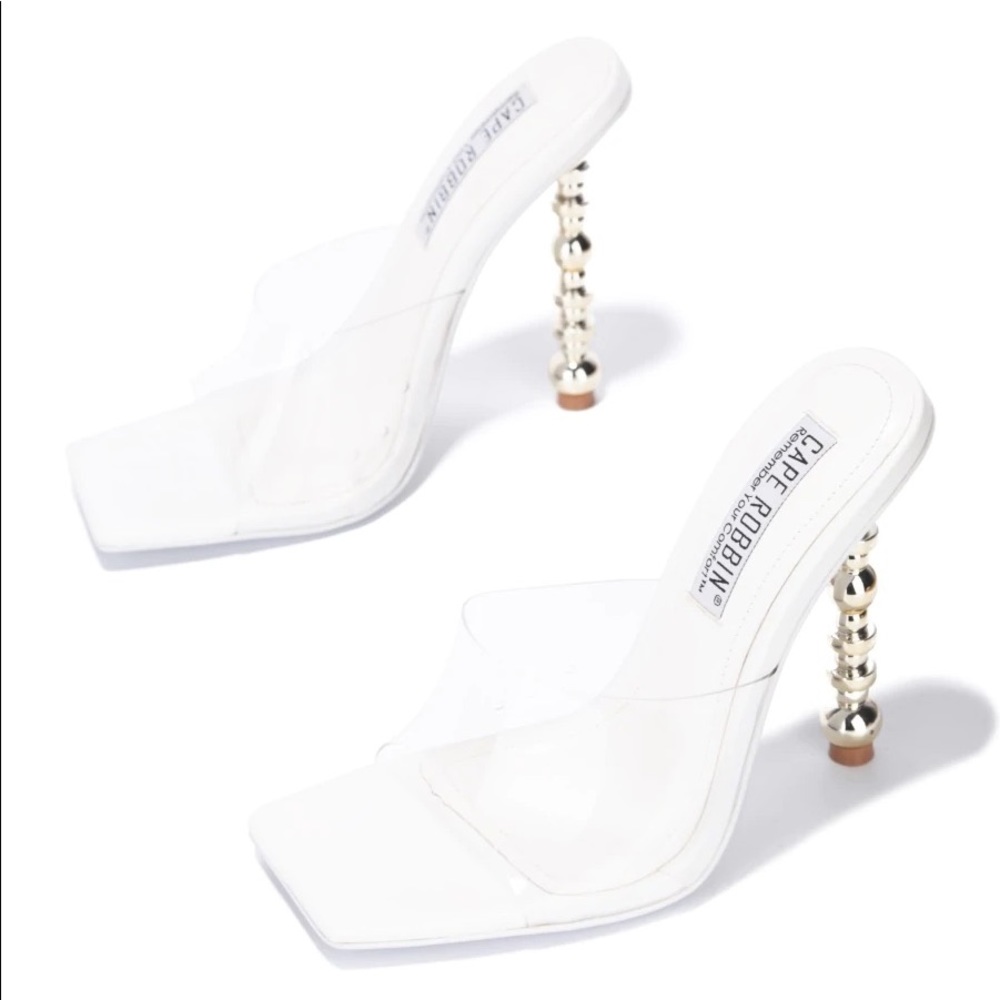 Womens pvc mules with with soles and golden heels.